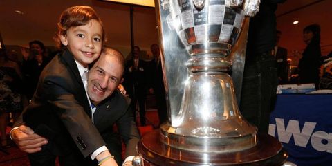 Indianapolis 500 winner Tony Kanaan and son Leo enjoy the moment in the spotlight in Detroit on Wednesday night.