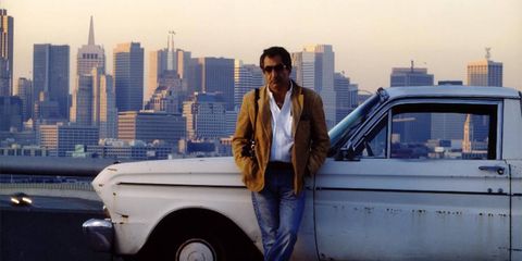 Marshall in front of his Ford Ranchero, and in front of his native San Francisco.