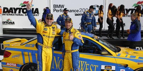 Bill Auberlen and Paul Dalla Lana celebrate after they thought they had won the Continental Tire SportsCar Challenge BMW Performance 200. The car failed postrace inspection and the team was disqualified.