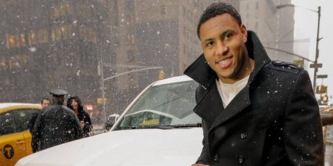 Smith poses next to the Silverado High Country in New York City on Monday, Feb. 3, after being voted Super Bowl XLVIII MVP