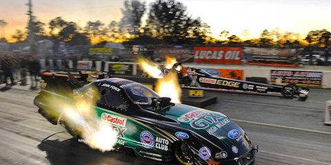 Funny Car champion John Force, in the near lane, went head-to-head with daughter Brittany Force during an NHRA test session at West Palm Beach, Fla.