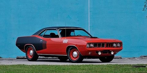 This unrestored Hemi Cuda from 1971 led the pack, bringing $560,000 on auction day.
