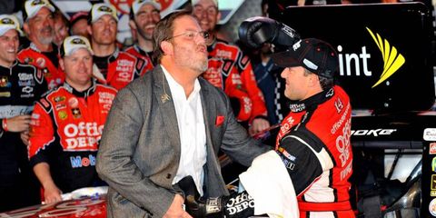 Tony Stewart celebrated his 2011 victory at Texas by slugging Eddie Gossage. Gossage is upset about the scheduling of the F1 race in Austin on the same day as one of Texas Motor Speedway's NASCAR races.