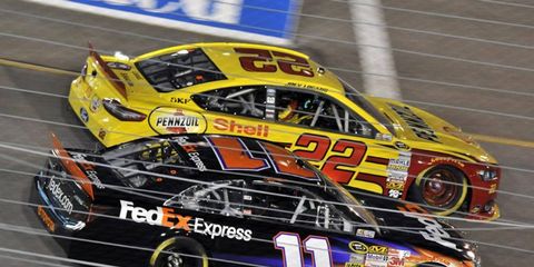 Denny Hamlin and Joey Logano are shown jockeying for position last year. This year, the two feuding drivers appear to have buried the hatchet.