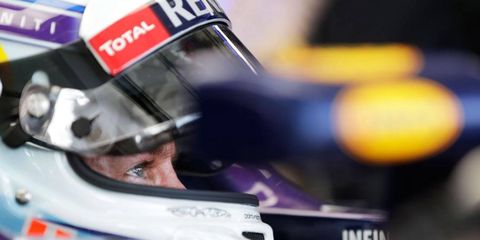 A wet track and a poor-handling car left the four-time and defending Formula One champion in 12th place in qualifying in Melbourne on Saturday.