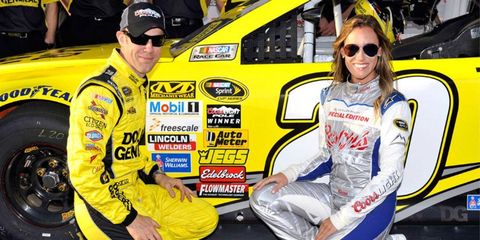 Matt Kenseth, left, poses for pictures on Friday after capturing the pole for Sunday's NASCAR Sprint Cup Series race at Fontana, Calif.