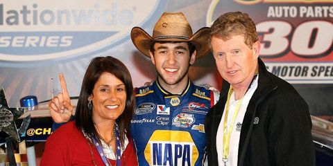 Dale Earnhardt Jr. is hoping that NASCAR's newest star, Chase Elliott, can bring JR Motorsports a Nationwide Series championship. Here's Chase, flanked by mom Cindy and dad Bill. Bill Elliott is a former Cup champion.