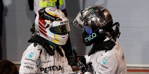 Nico Rosberg and Lewis Hamilton share a moment after the Mercedes teammates finished 1-2 at the Formula One Bahrain Grand Prix on Sunday.