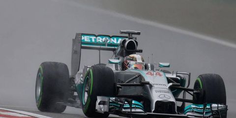 Lewis Hamilton conquered the wet track in Shanghai to earn his third pole of the Formula One season.