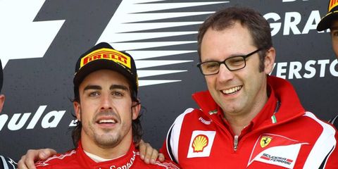 Fernando Alonso and Stefano Domecali pose for a picture after a race last year. Domenicali has stepped down from his role at Ferrari.