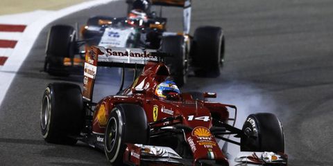 Ferrari's Fernando Alonso makes a move in Bahrain. On Monday, it was announced that Ferrari boss Stefano Domenicali was stepping down.