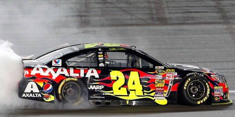 NASCAR Sprint Cup Series points leader Jeff Gordon celebrates his first victory of the 2014 season on Saturday night at Kansas.