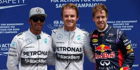 Pole sitter Nico Rosberg is flanked by Lewis Hamilton, left, and Sebastian Vettel in Canada following qualifying on Saturday.