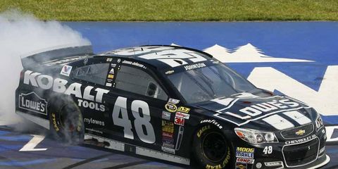 Jimmie Johnson celebrates his win at Michigan International Speedway with burnouts.
