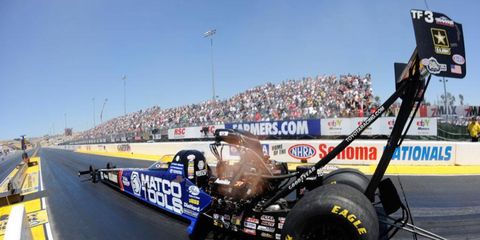 Antron Brown won the Top Fuel qualifying round on Saturday at New England Dragway.