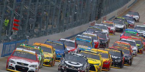 Kevin Harvick, front left, leads the field at Dover into the second round of the Chase.
