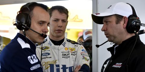 Paul Wolfe, Brad Keselowski and Brian Wilson discuss their Team Penske car in Las Vegas. Wolfe was put on probation for the rest of the season after NASCAR discovered the team pulled out the fenders on the car a bit.