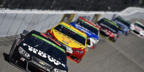 Martin Truex Jr. was in the lead Saturday night when NASCAR halted the Kansas race due to rain. NASCAR is still hoping to get the race in on Saturday night.