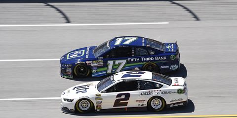 Brad Keselowski (2) and Ricky Stenhouse Jr. drive side by side in practice at Talladega, Ala., on Friday.