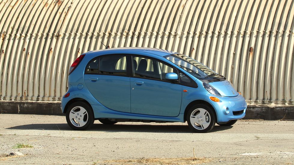 The i-MiEV is small, and it looks even smaller with its high roof and tiny wheels, but it has room for four adults inside.