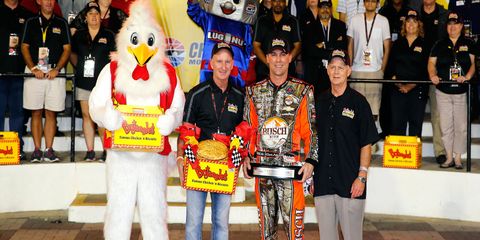 Anytime you're standing with a chicken in victory lane, it's probably a good day. Just ask NASCAR Sprint Cup Series pole sitter Kevin Harvick, third from left.