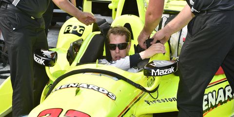 Brad Keselowski gets comfortable inside the No. 22 IndyCar at Road America on Wednesday.