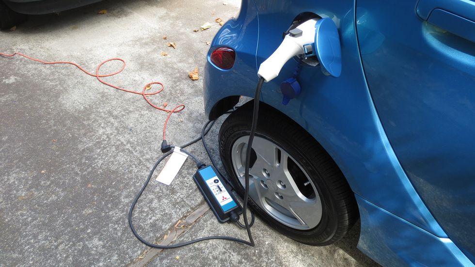 With a regular 120VAC household three-prong outlet and the i-MiEV's power adapter, you can get a full charge into the i-MiEV in about 14 hours.