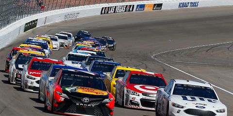 Brad Keselowski, right, leads the Monster Energy NASCAR Cup standings.