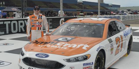Ryan Blaney and Wood Brothers Racing unveil the Omnicraft Auto Parts Ford Fusion paint scheme on Friday at Michigan.