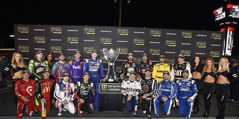 The 16 Playoff drivers with the Monster Energy Cup Series Trophy.