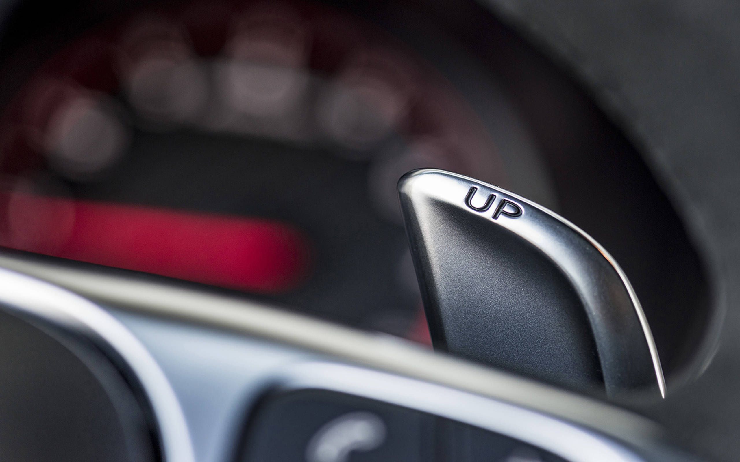 Among bells and whistles, cars shift to buttons, knobs