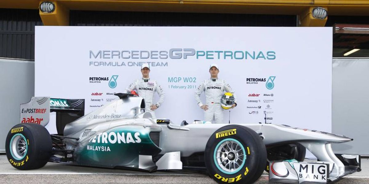 Mercedes drivers Michael Schumacher and Nico Rosberg with the new MGP W02