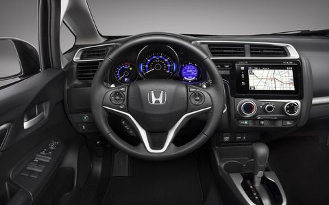The lack of buttons and knobs in the 2015 Honda Fit EX-L Navi isn't favored by our editors.