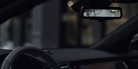 Using a streaming rear camera for the rearview mirror view removes passengers and headrests from the field of vision.