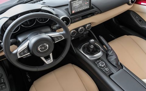 The 2017 Mazda MX-5 offers a sleek and sporty interior, with a hard roof to keep out wind and rain.