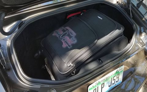 The trunk of the Fiat 124 Spider will fit a medium-size suitcase.