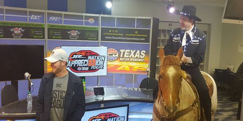 Texas Motor Speedway's Eddie Gossage rode in on a horse named Sarah Jessica Parker (ha ha, guys) to honor Dale Jr. as he retires.