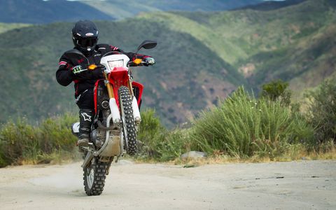 Honda's 250-cc dual-sport CRF250L and CRF250L Rally can handle on-road commuting as easily as they do off-road exploring. Both have a liquid-cooled single cylinder that makes enough power to get you out into the wide world but not enough to get you into too much trouble. And the price is only $5149. Perfect for beginner riders.