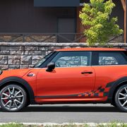 The Mini Cooper JCW delivers 228 hp and 236 lb-ft of torque from its 2.0-liter turbocharged four. This one is called the International Orange Edition.
