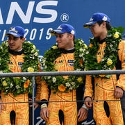 Wei Lu celebrates with teammates Jeff Segal and Rodrigo Bapbista on the podium of the&nbsp;2019&nbsp;24 Hours of&nbsp;Le Mans
