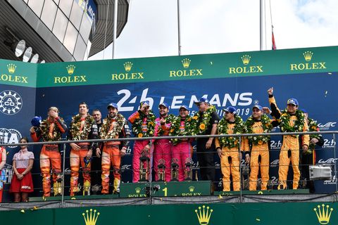 Wei Lu celebrates with teammates Jeff Segal and Rodrigo Bapbista on the podium of the&nbsp;2019&nbsp;24 Hours of&nbsp;Le Mans
