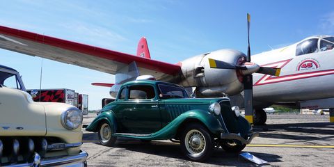 Here's what you missed at the second annual Wings and Wheels at Willow Run, which brought roughly 100 classic cars and almost 40 vintage aircraft to the historic airport in Ypsilanti, Michigan. Proceeds from the event went to support the Yankee Air Museum.
