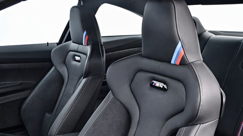 The 2019 BMW M4 CS gets a few special touches inside, like the punch-out CS logo in the dash.
