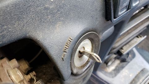 A junkyard car with the ignition key present generally came from a dealership as an unwanted trade-in or from an insurance auction for totaled cars.
