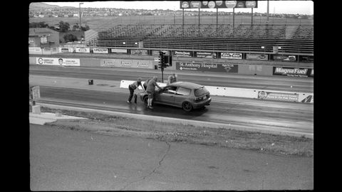 Here's the red B16-powered Civic after snapping an axle at the starting line, captured with my 1969 Soviet-made FED-2 35mm film camera.
