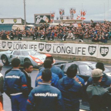 A rare color image from the 1966 24 Hours of Le Mans showing the No. 1 and No. 2 Ford GT40s.

