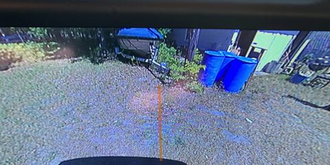 Hitch guidance is a back-up style camera pointed at the hitch and a straight orange line extending 10 feet or so to show you where to aim.
