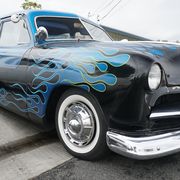 Mooneyes Xmas Show 'N' Shine returned to the shop for the first time in 16 years with lowriders, lead sleds and lots of flamin' good flames. Here's a flamin' blue custom 1950 Ford Tudor.
