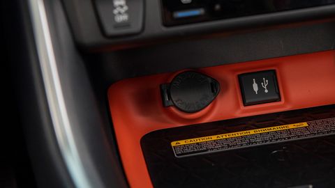The 2019 Toyota Rav4 Adventure features orange accents inside along with rubber trim on knobs and switches.