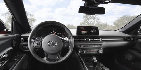 Inside the 2020 Toyota Supra. Unlike its predecessors, the new Supra trades a 2+2 layout for a two-seat configuration. The car gets an eight-speed automatic transmission that can be operated with shifter paddles.